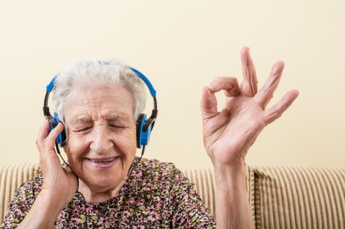 older-lady-listening-to-music-on-headphones