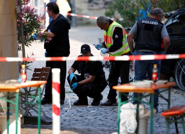 Police secure the area after an explosion in Ansbach, Germany, July 25, 2016. REUTERS/Michaela Rehle
