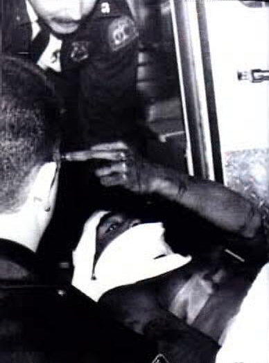 Tupac gesturing the night of November 30th, 1994. (2PacWorld)